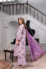 Side view of lavender dhanak suit with floral print and large printed wool shawl by Munira Designers