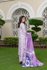 Side view of lavender dhanak suit with floral print and large printed wool shawl by Munira Designers