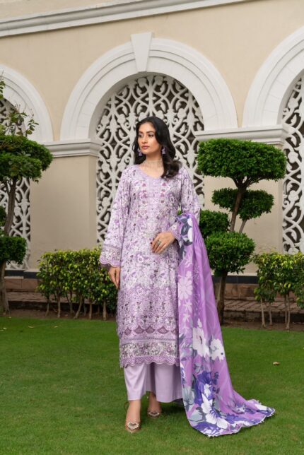Model wearing lavender dhanak suit with digital print, embroidery and floral wool shawl by Munira Designers
