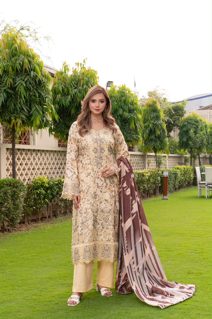 Golden Dhanak Suit Lubna Vol 15 Model wearing golden dhanak suit with floral print, embroidery and brown printed wool shawl by Munira Designers