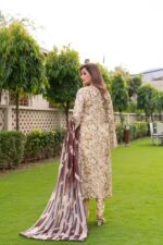 Back view of golden dhanak suit with floral print and long brown and cream striped wool shawl