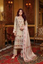 Woman wearing Mahi beige Dhanak suit with embroidered neckline and printed wool shawl