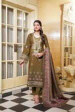 Woman wearing Mahi olive green Dhanak suit with floral embroidery and printed wool shawl